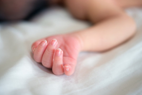 Close up newborn baby hand