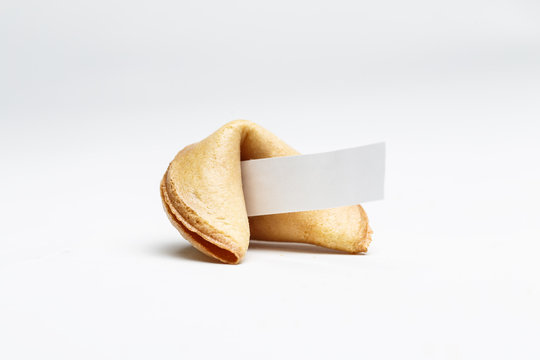 Picture of one Chinese cookie with wish on empty background.