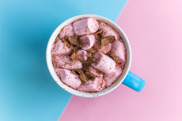 hot chocolate with marshmallows  top view   pink and blue  background