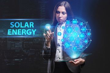 The concept of business, technology, the Internet and the network. A young entrepreneur working on a virtual screen of the future and sees the inscription: Solar energy