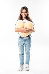 child holding heart shaped pillow