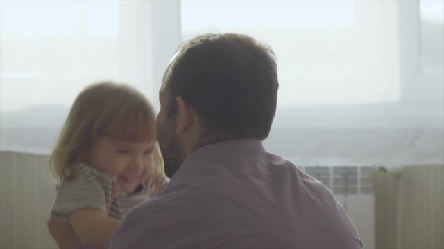 Little Son Rushes Into Mother's Arms At Home. Slow motion. Big Hug. Family values. Kiss.