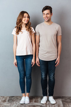 Full length portrait of a happy young couple standing