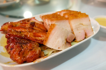 Roasted pork belly with barbecued red pork in Chinese restaurant