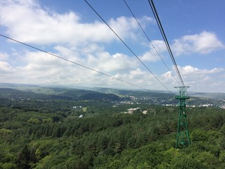  the mountains. North Caucasus. cableway. tower. green Forest. blue sky. clouds. nature. journey.