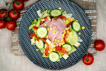 Fresh fruits salad and ham with egg