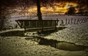 Wooden Pedestrian Bridge Across Stream