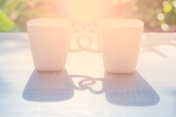 ceramic coffee cup and love sign