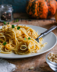 spaghetti with pumpkin sauce and pine nuts