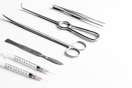 instruments for plastic surgery on white background
