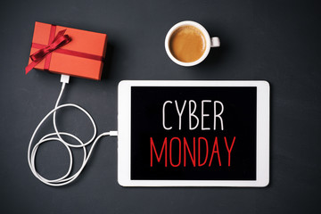 gift and text happy cyber monday in a tablet