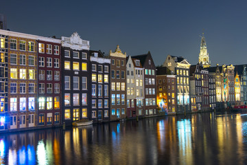 Amsterdam City Center. Beautiful view of Amsterdam Canals with Bridge and typical Dutch Houses. Amsterdam, Netherlands.
