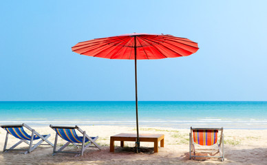 Beach chair and red umbrella on the beach ,Trat Province Thailand
