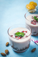 Winter fruit yogurt granola parfait. Healthy breakfast. Selective focus, copy space.
