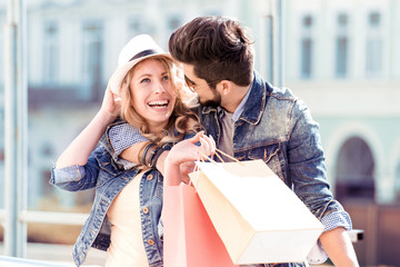 Beautiful couple enjoying shopping together.