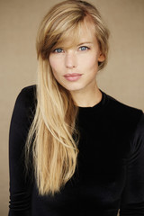 Portrait of beautiful blond woman in black