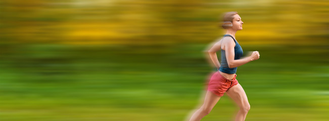 Young sport woman runs very fast. Motion blur on background.