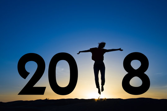 2018, silhouette of a woman standing in the sun, blue sky - Powered by Adobe