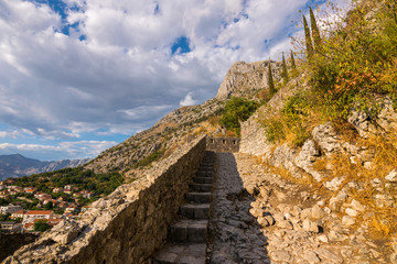 Fototapeta premium The old Mediterranean port of Kotor, Kotor fortress, Bay of Kotor, Kingdom of Dalmatia, Balkan Peninsula, Montenegro, Europe