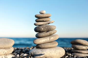  Seashore background with stone construction concept of balance and harmony