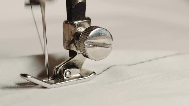 Old sewing machine in work process