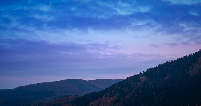 Time lapse over the sunset over the autumn Eifel hills in Germany