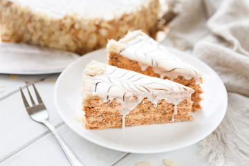 Esterhazy cake sliced on white plate close-up