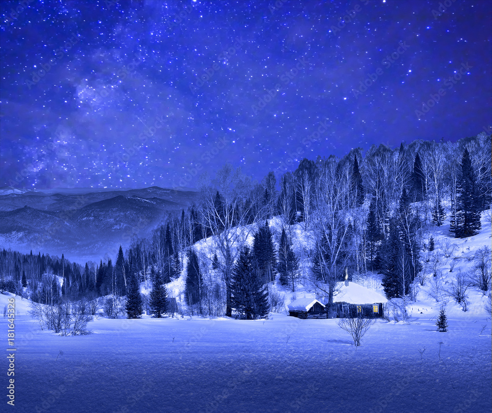 Wall mural small wooden house in a night winter mountain landscape with a beautiful starry sky