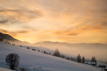 Winter landscape during sunset in Austria.