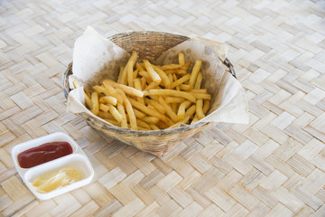 French fries in basket.potato chips snack background