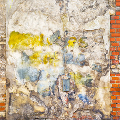 colorful painted abandoned stucco brick wall background
