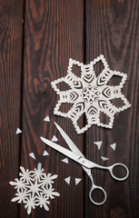 Making Christmas paper snowflakes.handcraft.Worplace.Handmade snowflakes