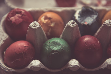 Broken colored eggs for Easter holliday, in cardboard box, vintage