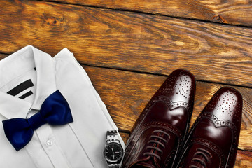 Dark brown brogues, white shirt and men's accessroies watch . Men's look .Set of gentlemen.
