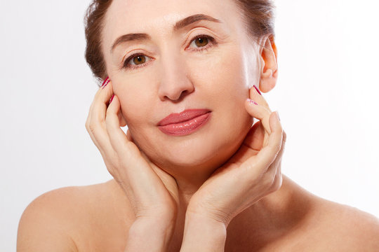 Macro Portrait Elderly Woman Face Isolated. Spa and Skin Care. Collagen and Plastic Surgery. Anti aging and Body Care Concept. Copy Space and Mock Up.