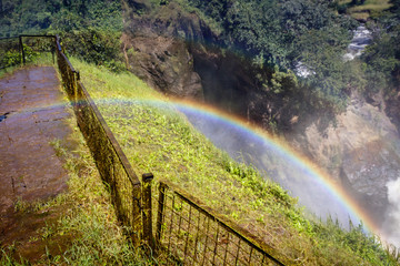 View inside the Murchison Falls, also known as Kabalega Falls. Showing a beautiful rainbow over the waterfall. Currently threatened by oil drilling companies