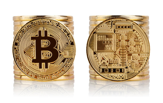Front and back of bitcoin against the background of stack of coi