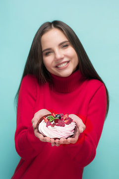 Beautiful women holding small cake. Birthday, holiday.