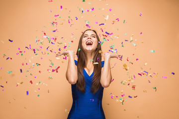 The woman celebrating birthday on brown background