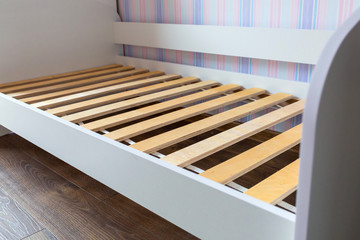 Assembling wooden bed in childrens room