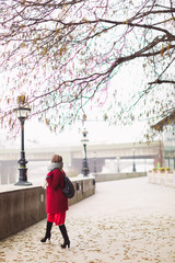 Side view of young elegant lady who walking outdoors