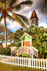 Fototapeta na wymiar wooden church on Maui surrounded by palm trees