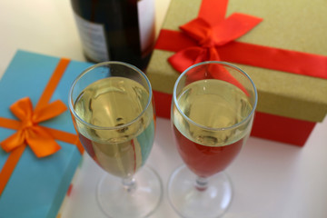 boxes with gifts and glasses of champagne