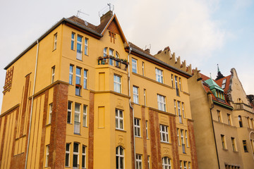 orange facaded residential house with brick details