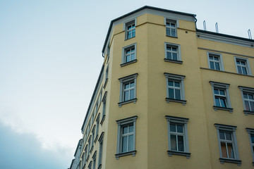 Fototapeta na wymiar yellow corner building in vintage tonage