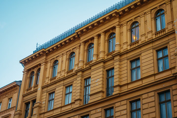 Fototapeta na wymiar orange marble building with residential facade
