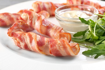 Plate with bacon wrapped chicken nuggets, closeup