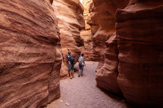 Couple of tourists exploring Red Canyon near Eilat, Israel