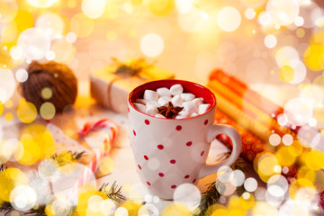 Cup of hot Chocolate drink. Cocoa with Marshmallows and cinnamon on wooden background with Christmas decorations.