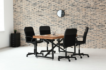 Modern room interior with big table and chairs